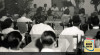Foto Ketua Koperasi Perwabi (Persatuan Warung Bangsa Indonesia) Basyaruddin Rahman Motik berpidato dalam pertemuan memperingati Hari Koperasi di Garden Hall. (sekarang Taman Ismail Marzuki), Jakarta, 12 Juli 1951. Sumber : ANRI, Kempen Jakarta RI 1951 No.