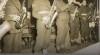 Foto Korps musik dari Australian Army Amenities Service mengunjungi Kamp Columbia, Brisbane dan memberikan beberapa hiburan untuk orang-orang Belanda, Australia dan Indonesia. 15 Mei 1945.