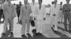 Komisaris Jenderal untuk Asia Tenggara Sir Malclom MacDonald dari Inggris disambut kedatangannya oleh Ketua Biro Protokol Departeman Luar Negeri Indonesia Kusumo Utojo di Bandar Udara Kemayoran, Jakarta, 28 Agustus 1951.